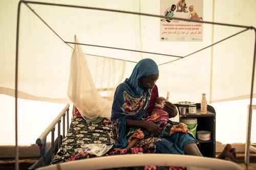 Halima Hamdan, 35, Sudanese, gives therapeutic milk to her son Nassir Hamat Mahamat, 20 months old and weighing 4.7 kilograms, while he is being treated for severe acute malnutrition with complications in the Inpatient Therapeutic Feeding Centre (ITFC) run by Médecins Sans Frontières at the Adré Urbain health centre in Adré, eastern Chad.