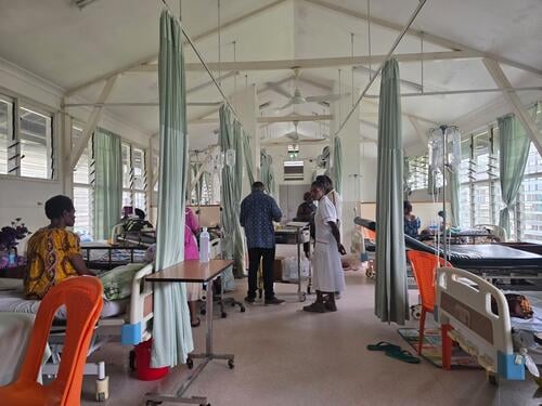 Palliative care ward at ANGAU Memorial Provincial Hospital, Morobe Province, Papua New Guinea. Newly recruited nurses attend to patients as part of MSF led on-the-job training to strengthen palliative care services in collaboration with the hospital.