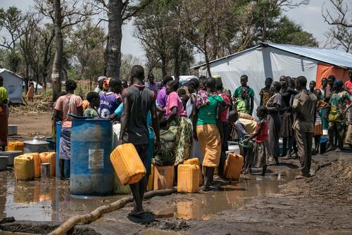People fetching water in Palorinya refugee camp, Uganda