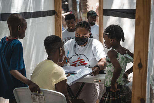 Annette Souffrant with her three children at the mobile clinic