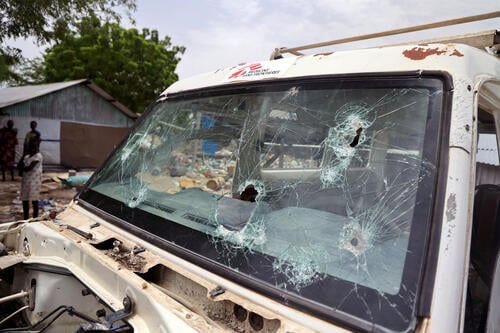 Bullet holes on the windshield of a MSF car