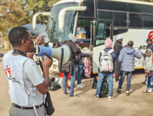 Douglas Zulu addresses a group of Zimbabwean returnees at the Beitbridge Reception Centre before they continue their journey home. As one of four MSF Community Health Workers at the centre, he delivers daily health education sessions and connects returnees to essential health and support services. MSF is working alongside the Ministry of Health and Child Care to provide medical care and

humanitarian assistance to the growing number of Zimbabweans returning from South Africa following anti-migrant protests.