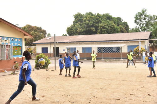 Adolescents playing volleyball at the Médecins Sans Frontières/MSF-supported Adolescent Friendly Centre (Ester's clinic) in Mile 91 town, Tonkolili district, Sierra Leone. The centre provides free sexual and reproductive healthcare services to adolescents as well as social activities. The social component of the centre includes volleyball and football sessions, computer classes, arts and crafts, board games and peer group discussions.