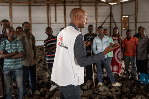 MSF Health Promoter Aristote Saidi Wanyama presents the symptoms and signs of mpox during a meeting with leaders of the residents in the Kanyaruchinya displacement site.  

Such leaders play a crucial role in disseminating information and ensuring that their communities respond swiftly to any signs of the disease.