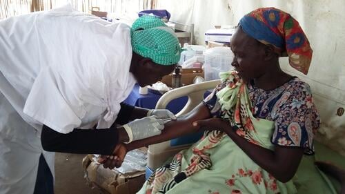 MSF receives treatment from a community health worker