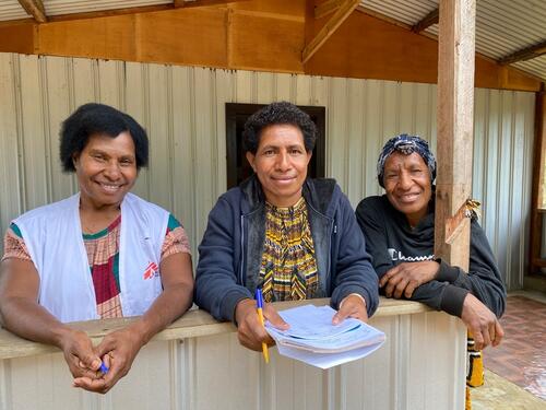 0153 - Janet, MSF Community engagement supervisor with community health worker and village health volunteer