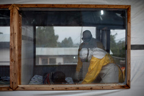 Medical staff in full PPE do the medical shift to check the state of the suspected cases of Ebola.