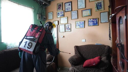 For the application of TIRS, the MSF team worked in pairs to take turns with the spraying equipment.
