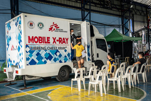 Residents wait for their turn for a free chest x-ray at the MSF mobile TB screening in Barangay 133 covered court, Tondo, in the city of Manila, the Philippines, March 1, 2023.