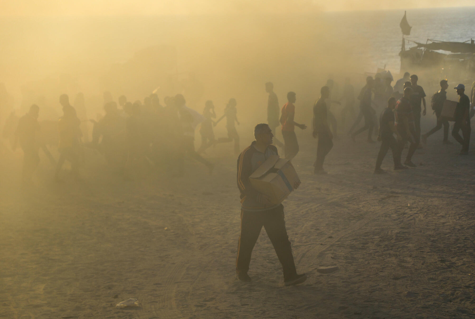 Palestinians gather at a food distribution site in Netzarim, Gaza.