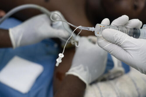 Staff at the Rutshuru General Reference Hospital prepare to administer local anaesthetic to a patient.