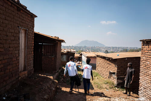 Two members of the MSF palliative care team on a visit in a neighborhood on the outskirts of Blantyre, Malawi, on July 23, 2026.