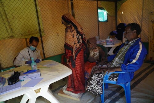 Two sisters being examined at MSF’s mobile clinic