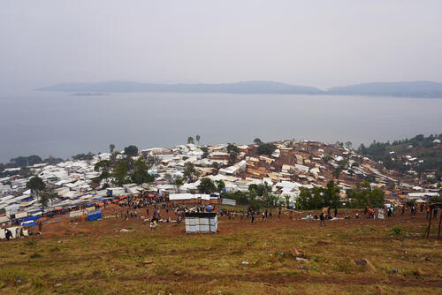 Lomera's population has exploded following the discovery of gold in late December 2024. What was once a lakeside village of 1,500 residents has rapidly expanded into a sprawling settlement of makeshift shelters, now housing a growing transient population exceeding 12,000. While cholera is endemic in this region of the DRC, Lomera exhibits all key risk factors for an outbreak: inadequate clean water access; overcrowding; insufficient latrine capacity and open defecation; limited handwashing facilities; low vaccination coverage (the last vaccination campaign occurred in 2022); and the settlement's hillside location, where untreated waste flows downward into the lake, perpetuating contamination.