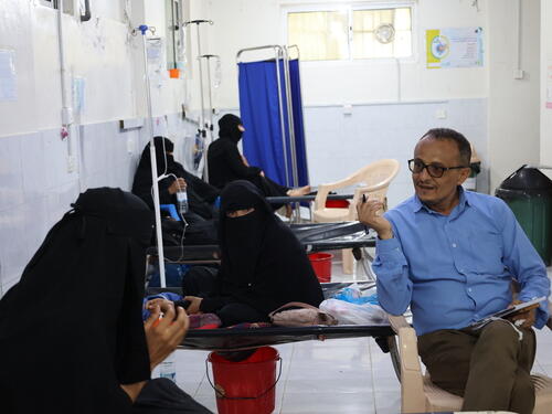 A psychologist holds a group mental health session