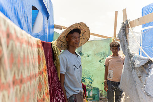 “I came with my mom, my aunt, my grandmother, and my brothers. It is the entire family. We fled by a miracle, because the roads were closed,” explains Maher standing next to his neighbor living in the tent right next to him.
