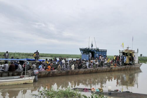 A boat used to transfer hundreds people docks at Bulukat port