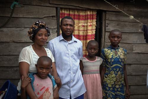 Daniella, a 10-year-old girl, photographed with her family after her discharge from the Munigi Ebola Treatment Center (ETC).
