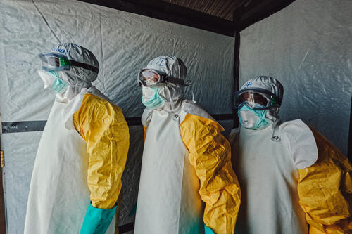 In Bunia, DRC, a team of healthcare workers wear full PPE to prevent the spread of Ebola while treating patients