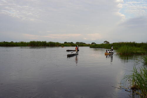 Children going to school by canoe