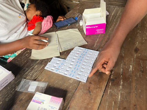 Rapid malaria testing is carried out on children with fever who come for measles vaccination.