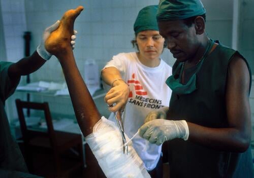 Magburaka, Sierra Leone, October 2002Danish anaesthetist Vibeke Brix Christensen and Ethiopian surgeon Mesfin Wondimu changes a bandage.