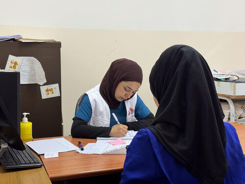 An MSF staff attends a patient during a mobile clinic in Khallet Al Mai, Hebron, West Bank. Occupied Palestinian Territory.