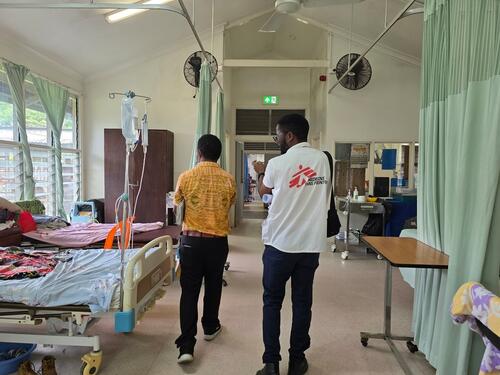 MSF staff and a hospital doctor walk through the palliative care ward at ANGAU Memorial Provincial Hospital, Morobe Province, Papua New Guinea.