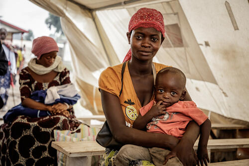 Naomi and her son Alexis at the Kanyaruchinya health centre