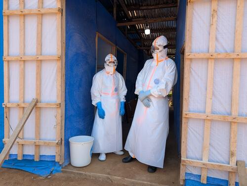Two medical team members wait for a patient suspected of having Ebola in the triage area of Nia-Nia Hospital, Ituri province, on 3 September 2026.
