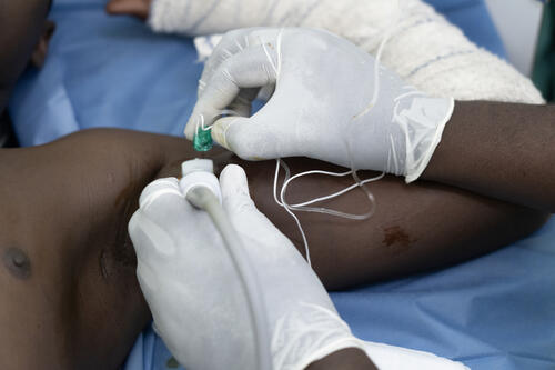 Staff at the Rutshuru General Reference Hospital administer local anaesthetic to a patient