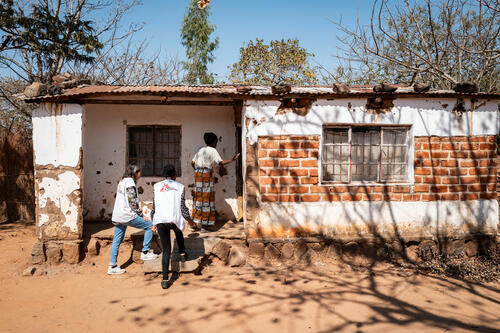The MSF palliative care team enters Grace Nyambi's home in Chileka, in Blantyre district, on July 21, 2026. Grace prefers home visits, she said.