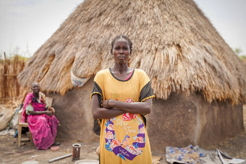 Mary Abur Thon stands in front of her house in Aree village in Akoka County, Upper Nile State