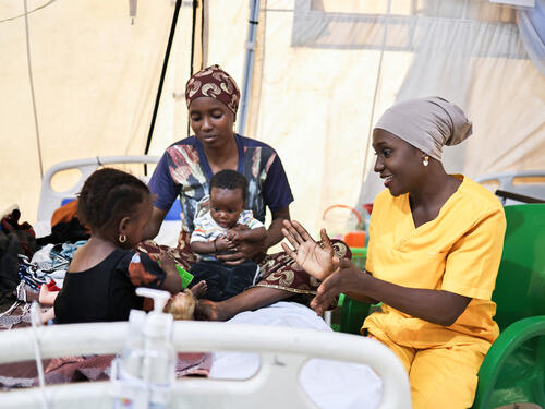 MSF counsellor educator, Keturah John engages Adama’s daughter, Fatima, in a play therapy session at MSF’s facility Nilefa Kiji in Maiduguri, Borno state, northeast Nigeria. Fatima is on admission and has been receiving treatment for malnutrition.