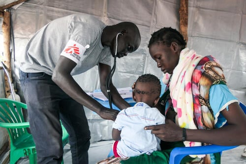 MSF Clinical Officer examines a child at the MSF Mobile Clinic