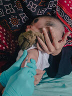 Labiba holding her child Fariha