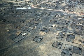 Burned dwellings in the town of Leer, South Sudan