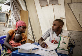 Naomi and her son Alexis come to consult at the Kanyaruchinya health centre