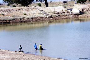 Children fetching water fromthe articificial lake in Pulka