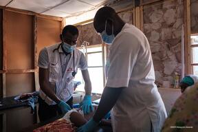 Doctors treating a child in Shinkafi hospital
