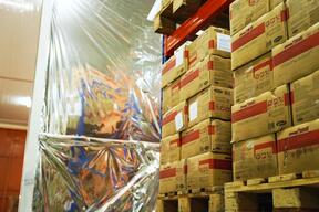 Therapeutic food boxes stacked in MSF warehouse, Juba