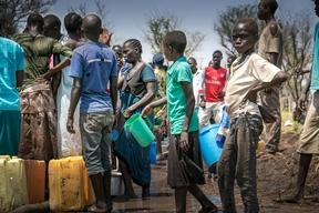 People fetching water in Palorinya refugee camp, Uganda