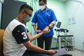 MSF doctor Dr Sara examines  Shafiee Abdullah, 45