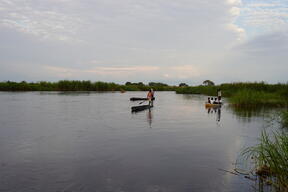Children going to school by canoe