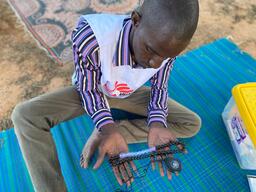 Saving children’s lives with bead necklaces in Mali