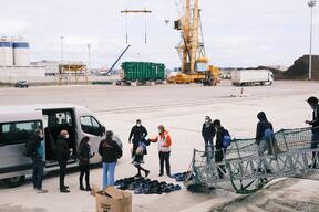 Survivors are seen disembarking from the Geo Barents