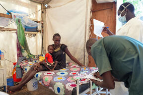MSF clinical officer and nurse check on Nya Thor