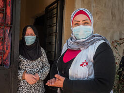 Fawziyya Al-Sahili with social worker