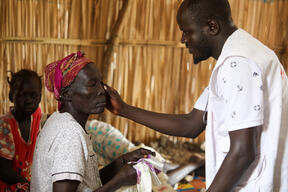 Clinical Officer Abit Dau examines a patient at MSF mobile clinic
