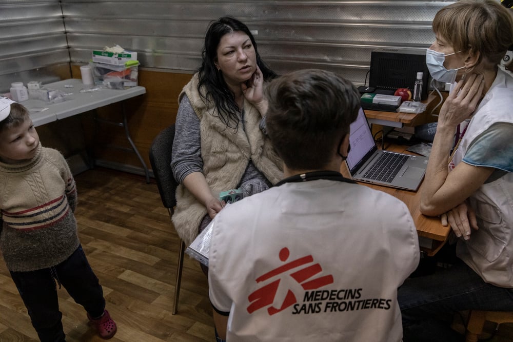 Elena, 35-years-old and her son Kirill, 6-years-old are seen by MSF doctor Kelly and Kirill, Ukrainian medecine student, in Kharkiv, Ukraine, on April 11, 2022.